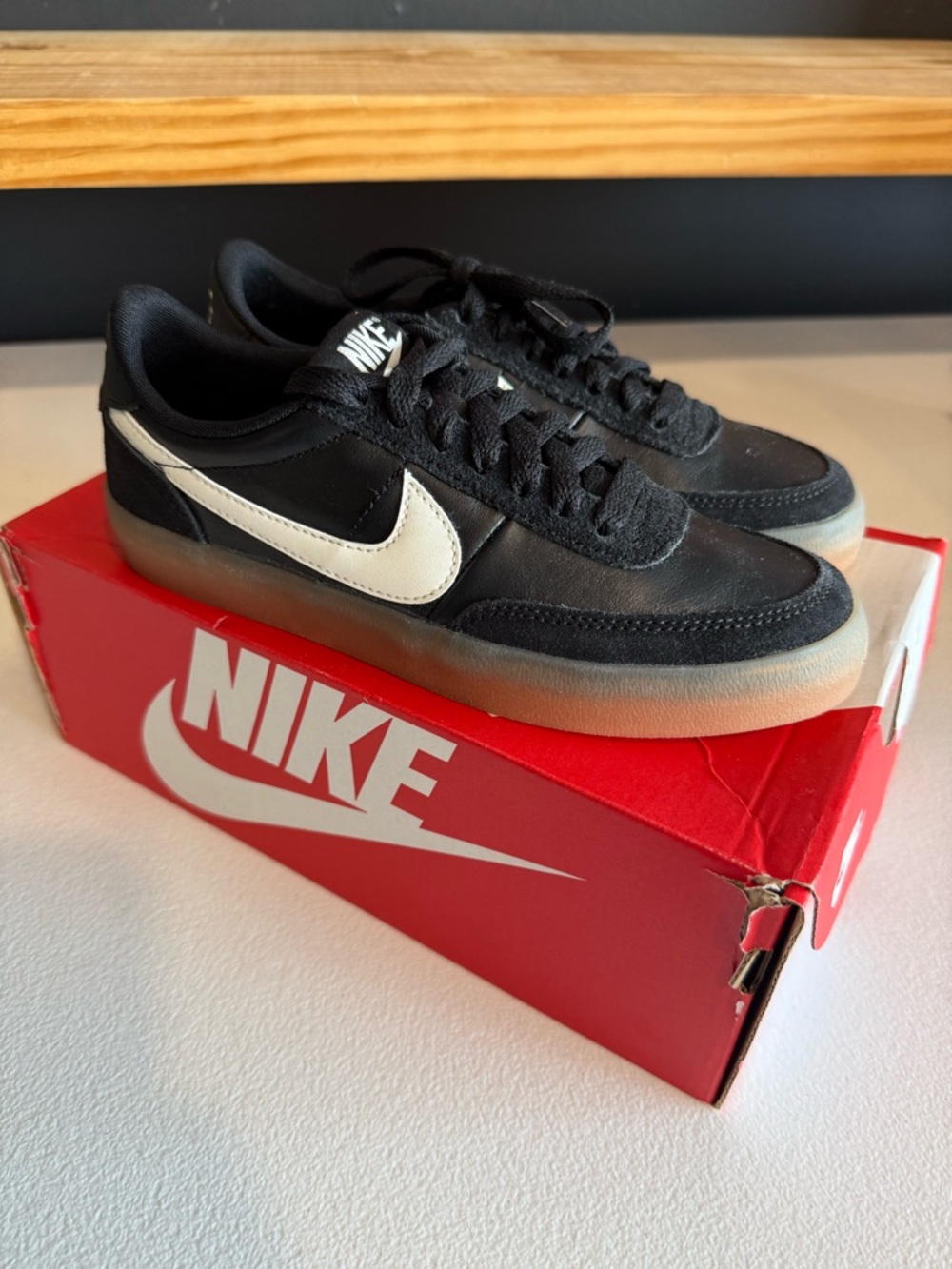 Nike Black Sneakers with White Swoosh and Gum Sole